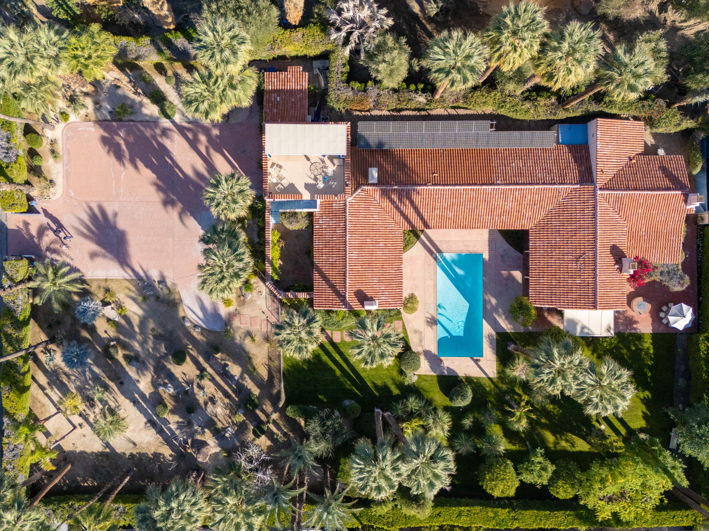 1050 North Cahuilla Road Palm Springs, CA 92262 - Photo 1 of 32 a backyard of a house with lots of green space