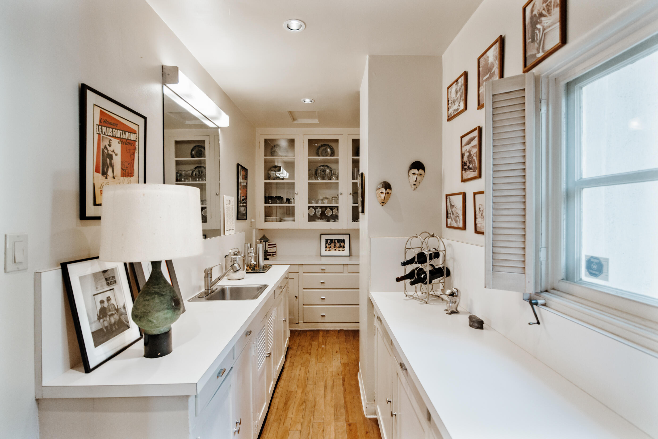 1050 North Cahuilla Road Palm Springs, CA 92262 - Photo 12 of 32 a spacious bathroom with stainless steel appliances a sink a couch and a window