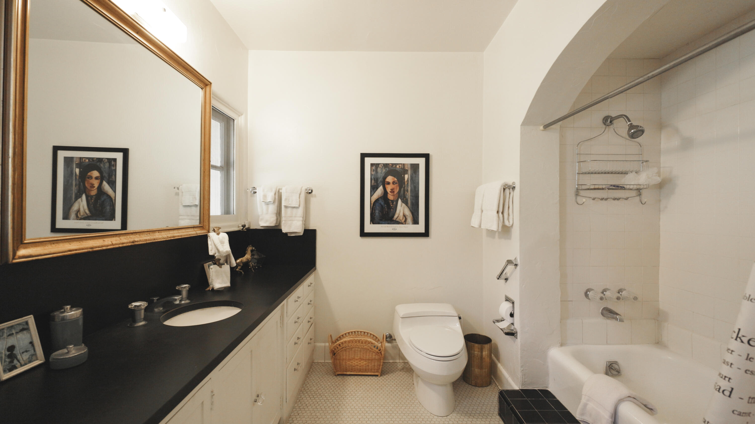 1050 North Cahuilla Road Palm Springs, CA 92262 - Photo 17 of 32 a bathroom with a double vanity sink toilet mirror and shower