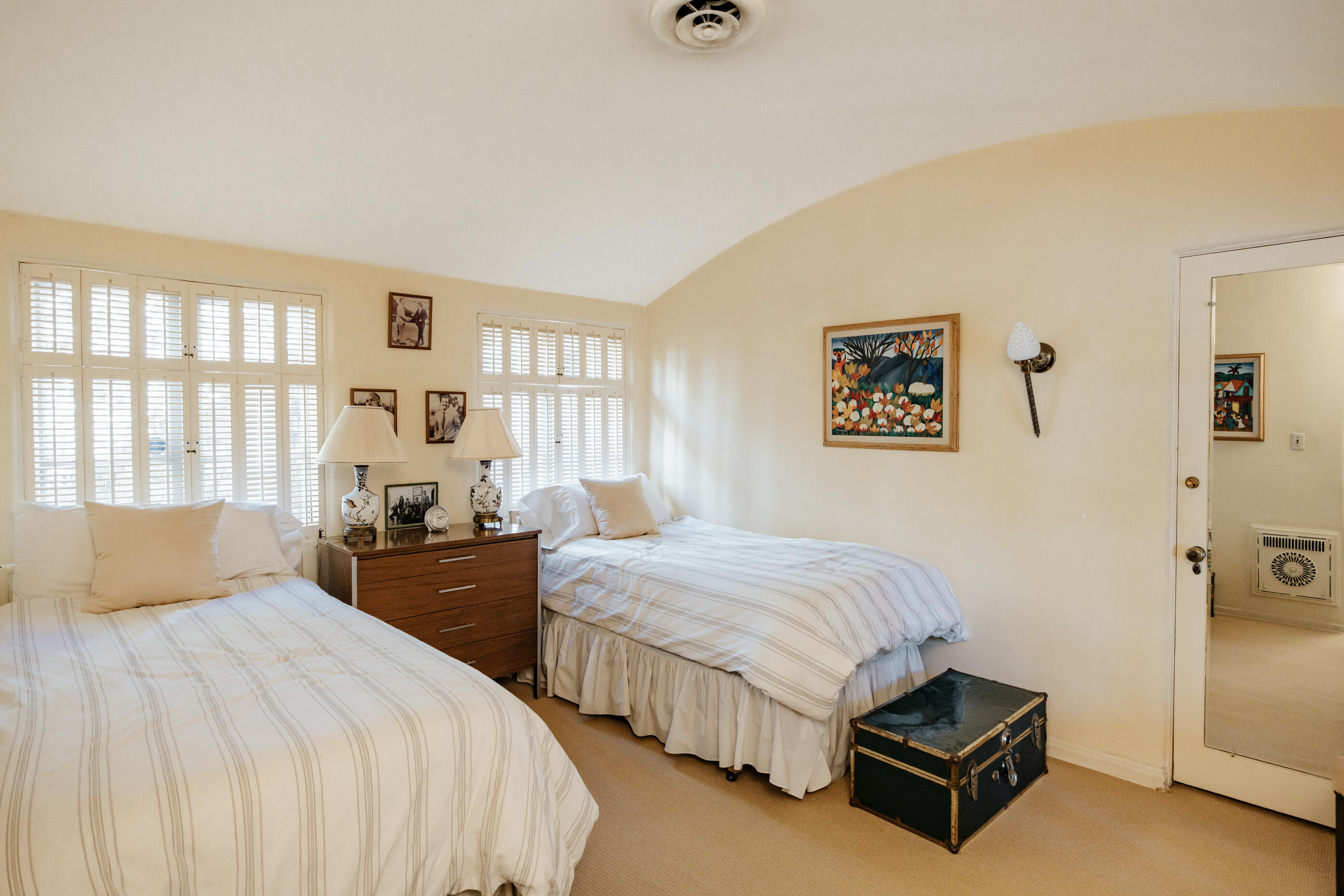 1050 North Cahuilla Road Palm Springs, CA 92262 - Photo 24 of 32 a bedroom with two beds and painting on the wall