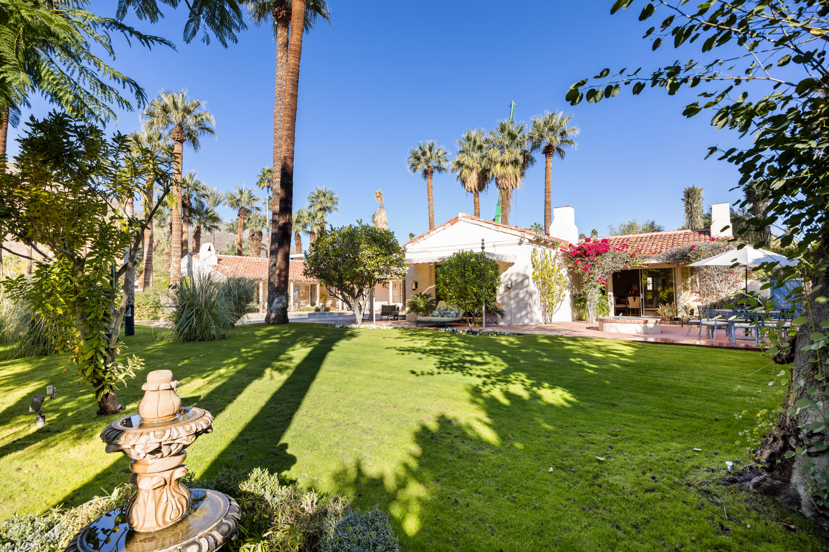 1050 North Cahuilla Road Palm Springs, CA 92262 - Photo 31 of 32 a swimming pool with outdoor seating and yard