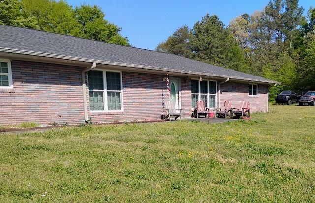 392 Nickelsville Road Northeast Resaca, GA 30735 - Photo 1 of 14 a front view of house with yard and green space