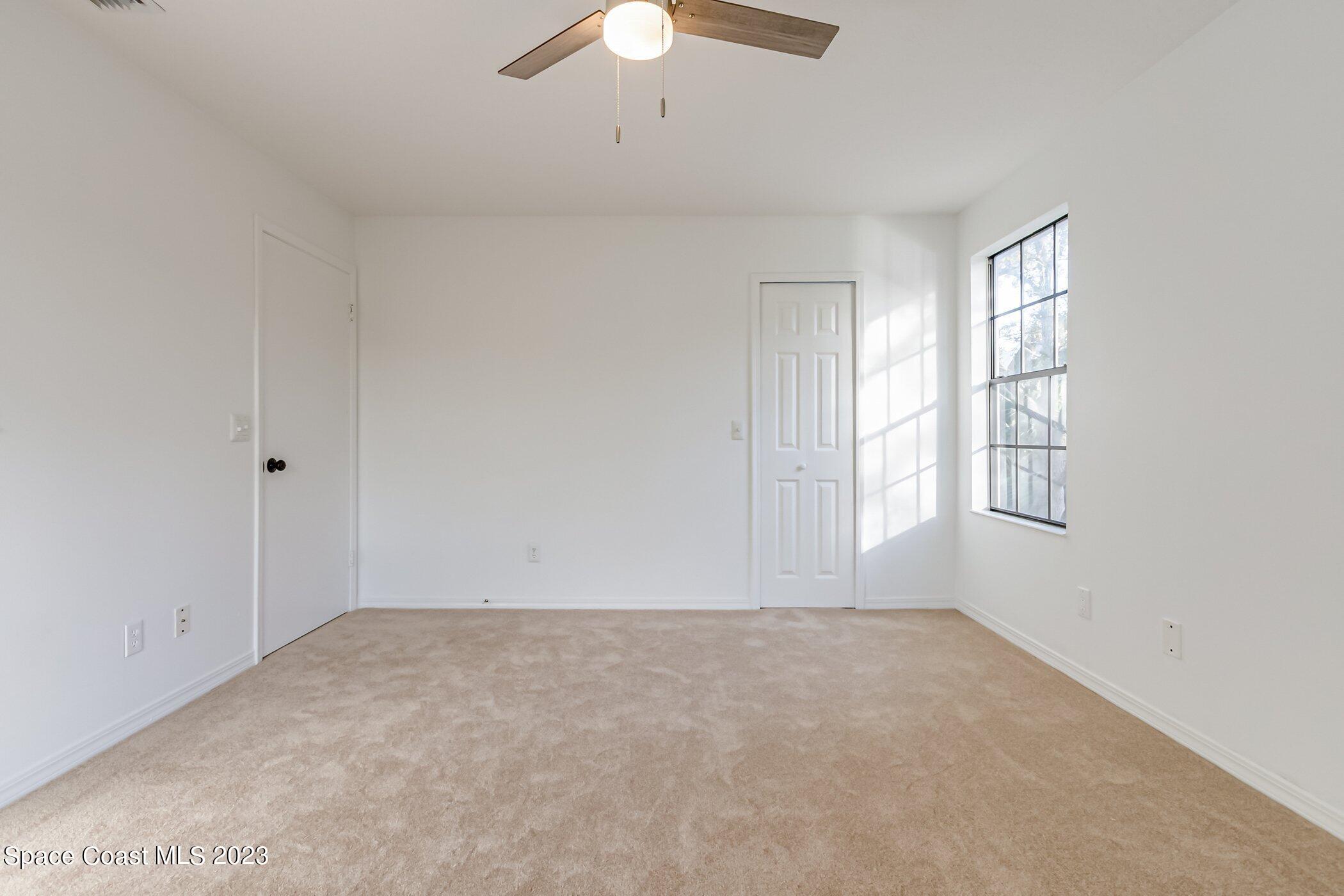 7667 North Wickham Road, Unit 218 Melbourne, FL 32940 - Photo 19 of 35 a view of an empty room with a window