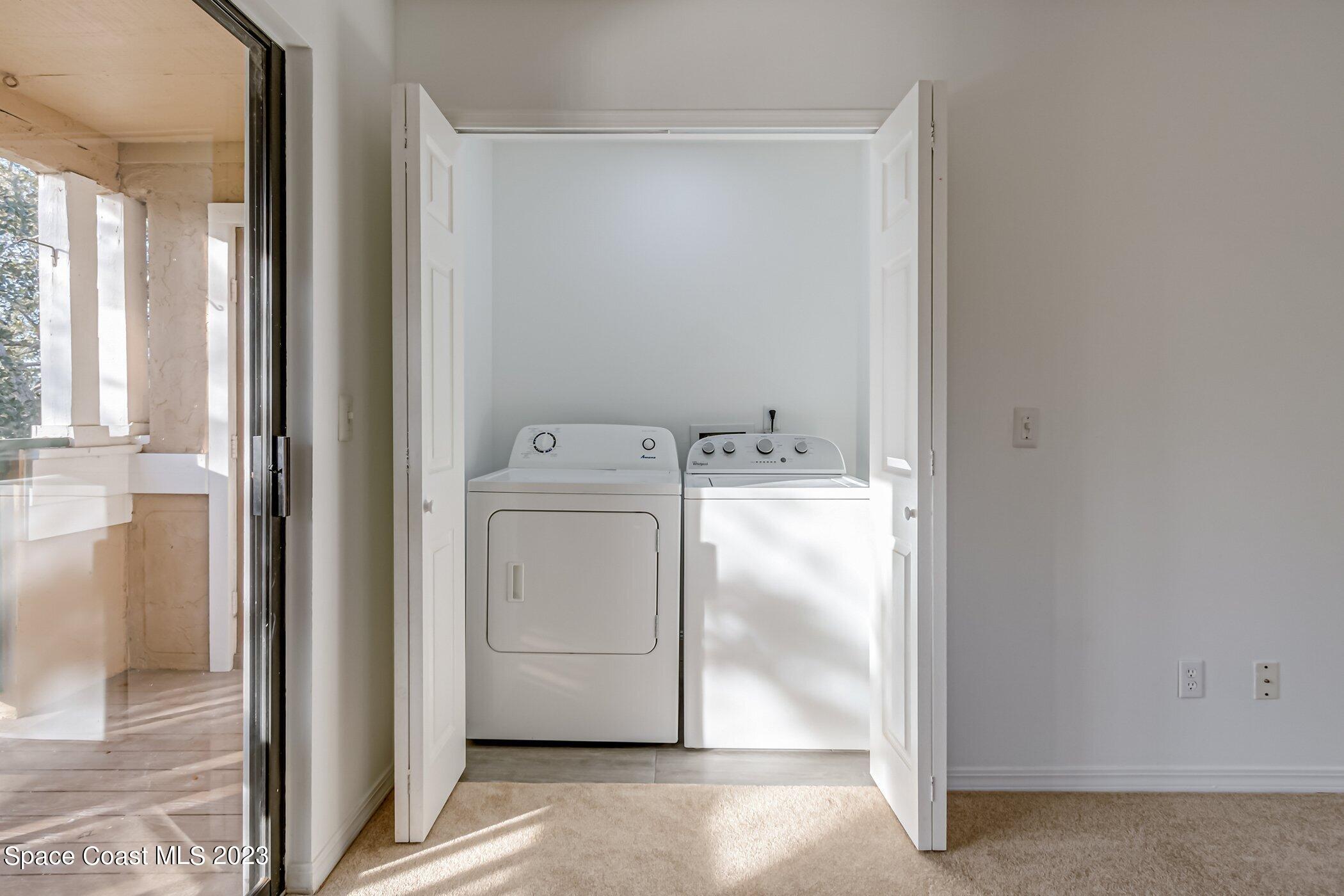 7667 North Wickham Road, Unit 218 Melbourne, FL 32940 - Photo 20 of 35 a utility room with dryer and washer