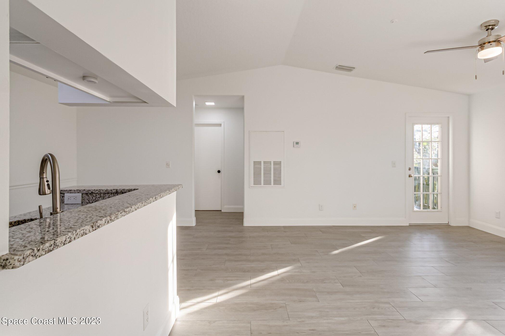 7667 North Wickham Road, Unit 218 Melbourne, FL 32940 - Photo 2 of 35 a view of a kitchen with a sink and dishwasher