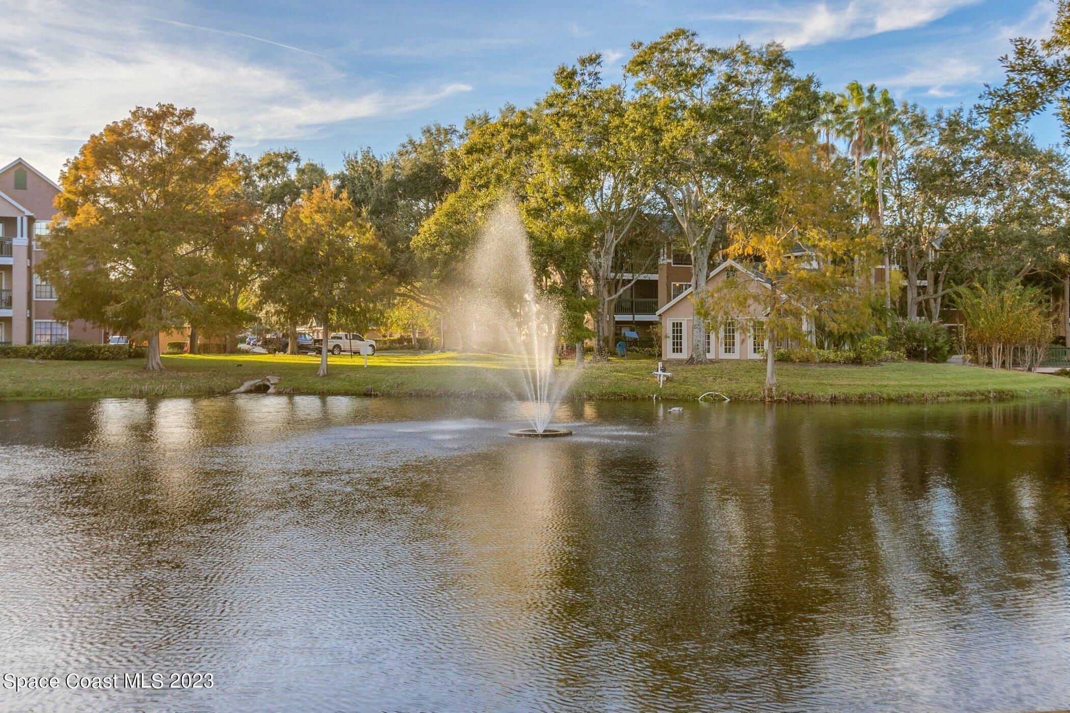 7667 North Wickham Road, Unit 218 Melbourne, FL 32940 - Photo 23 of 35 a view of a lake with houses