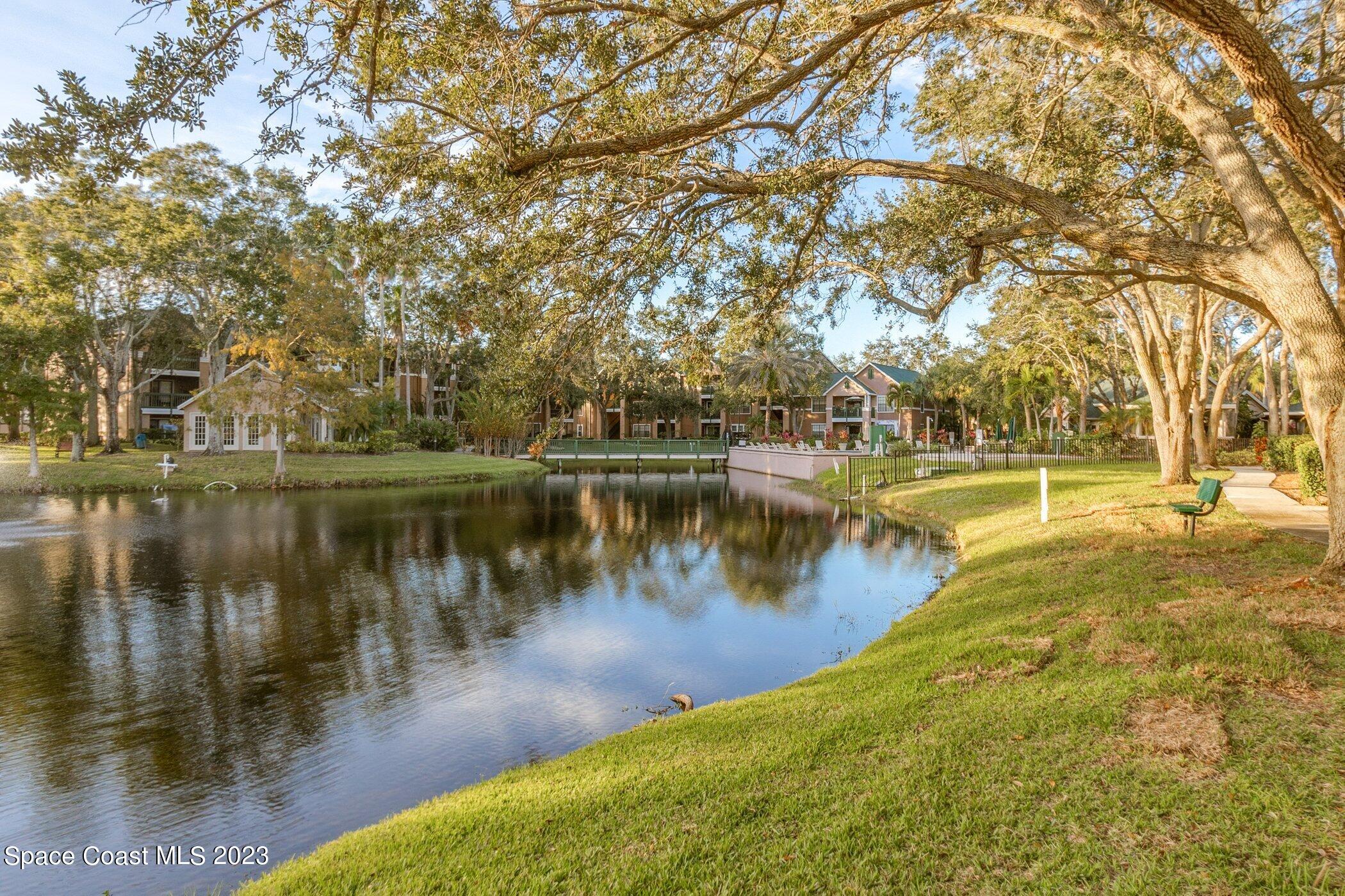 7667 North Wickham Road, Unit 218 Melbourne, FL 32940 - Photo 24 of 35 a view of a lake with houses