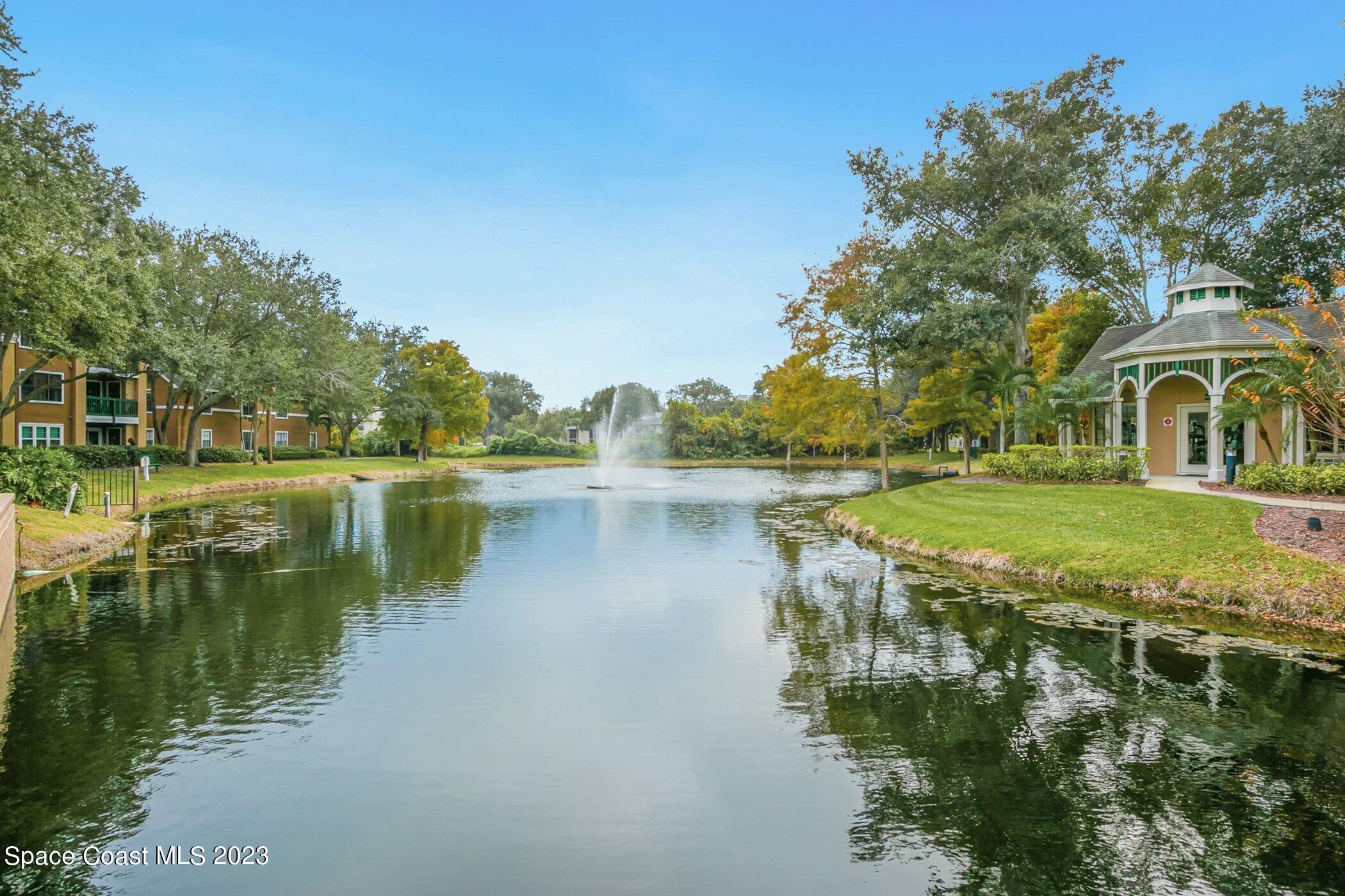7667 North Wickham Road, Unit 218 Melbourne, FL 32940 - Photo 33 of 35 a view of a lake with houses