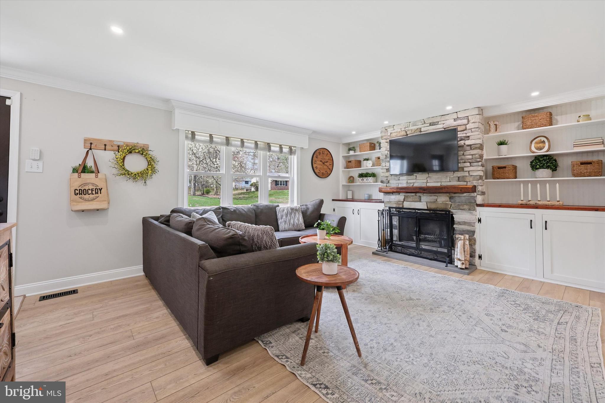 Living room w/ wood burning fireplace