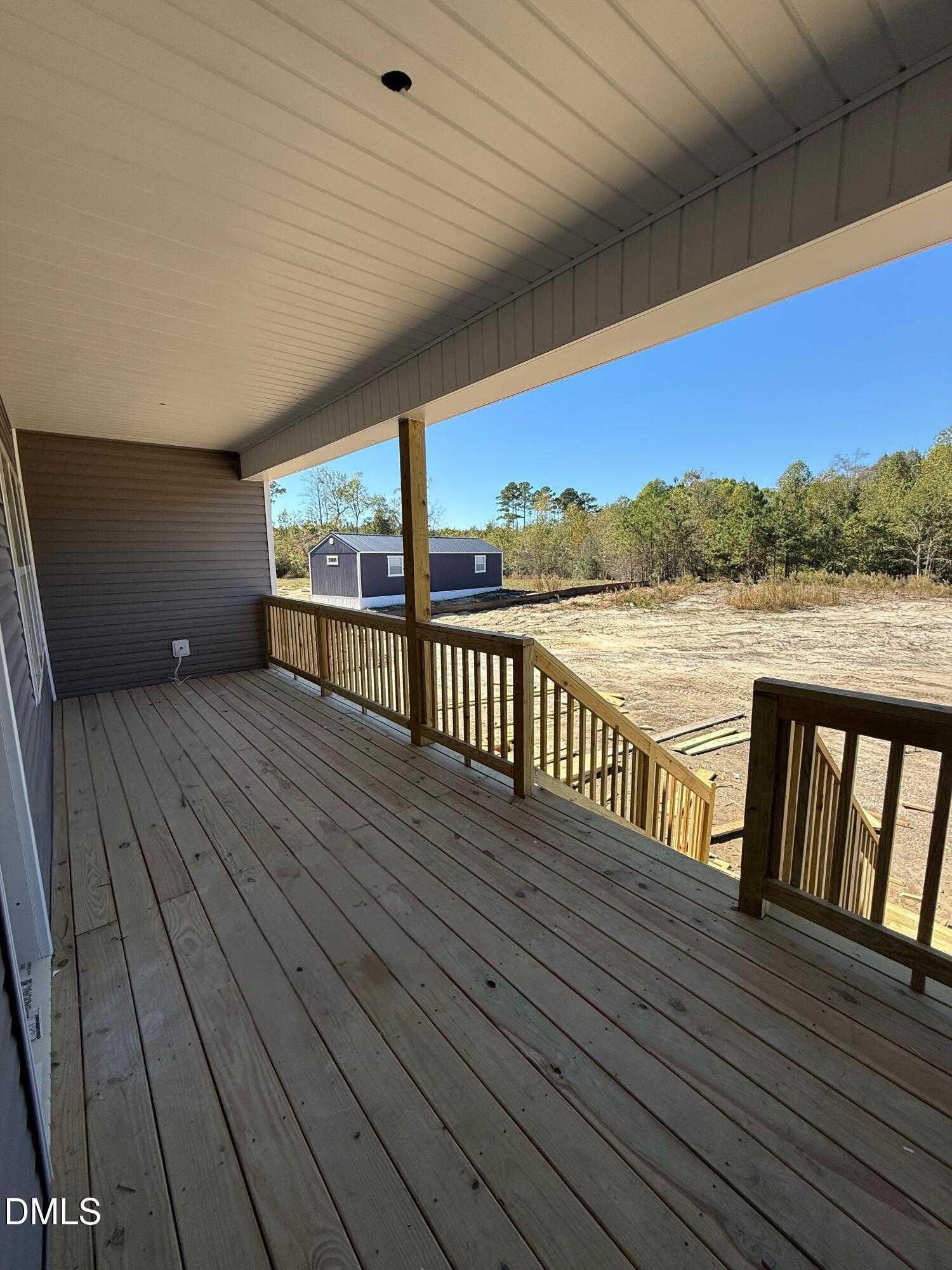 30 Lemon Drop Lane Louisburg, NC 27549 - Photo 16 of 21 a view of a balcony with wooden floor and outdoor space