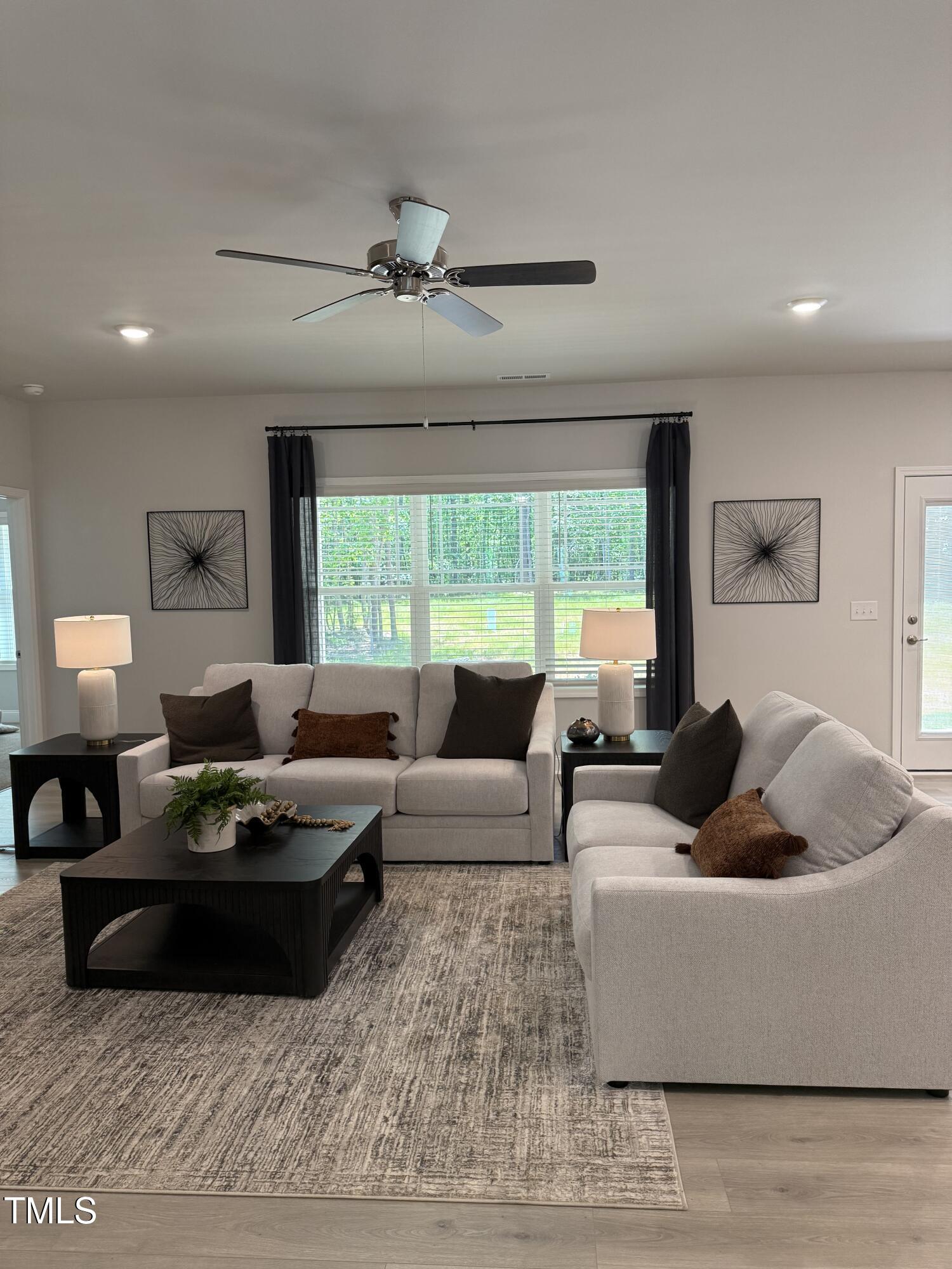 30 Lemon Drop Lane Louisburg, NC 27549 - Photo 9 of 21 a living room with furniture and a large window