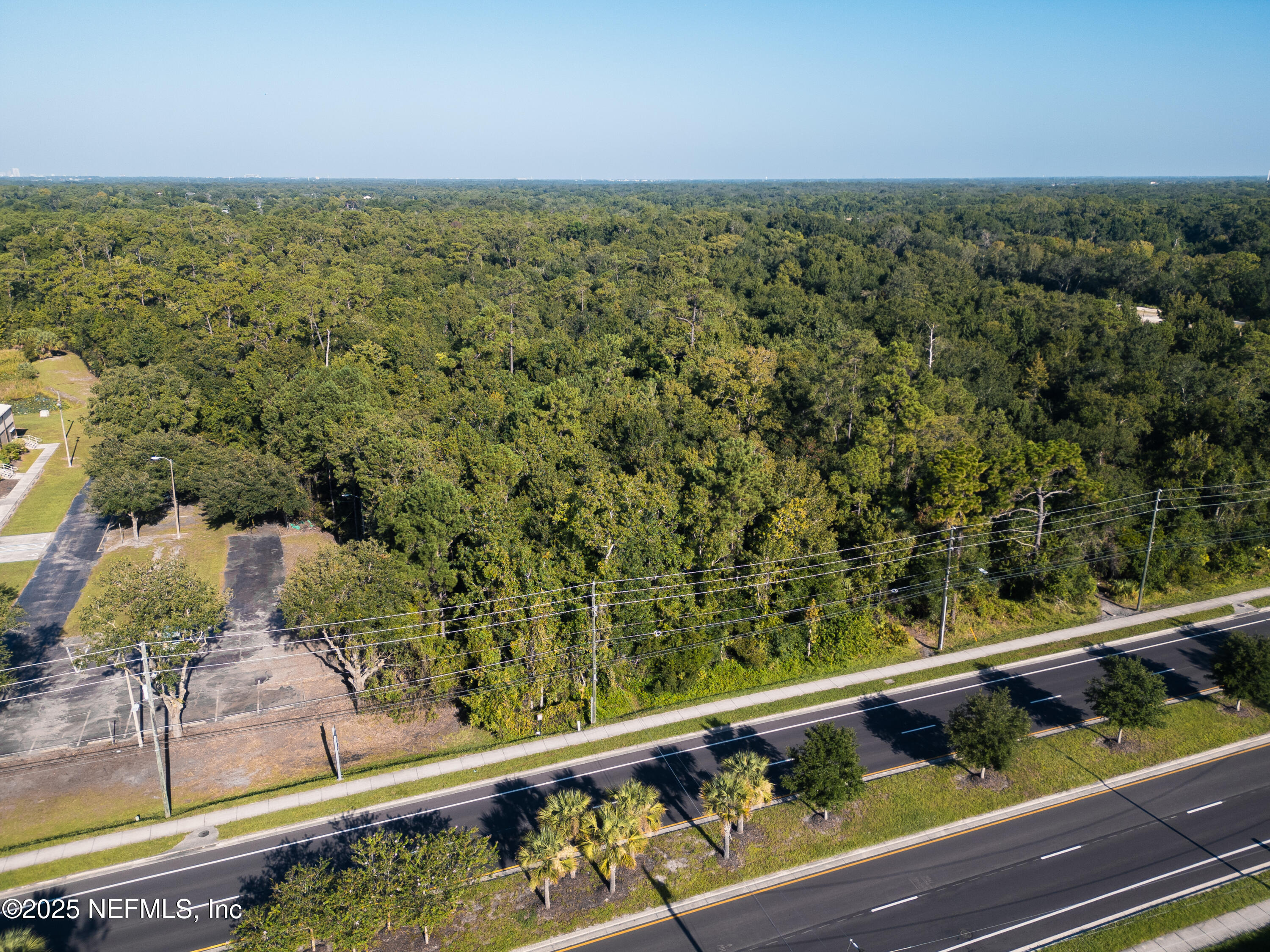 2316 Rouse Road Orlando, FL 32817 - Photo 11 of 13 a view of a balcony with mountain view and wooden floor