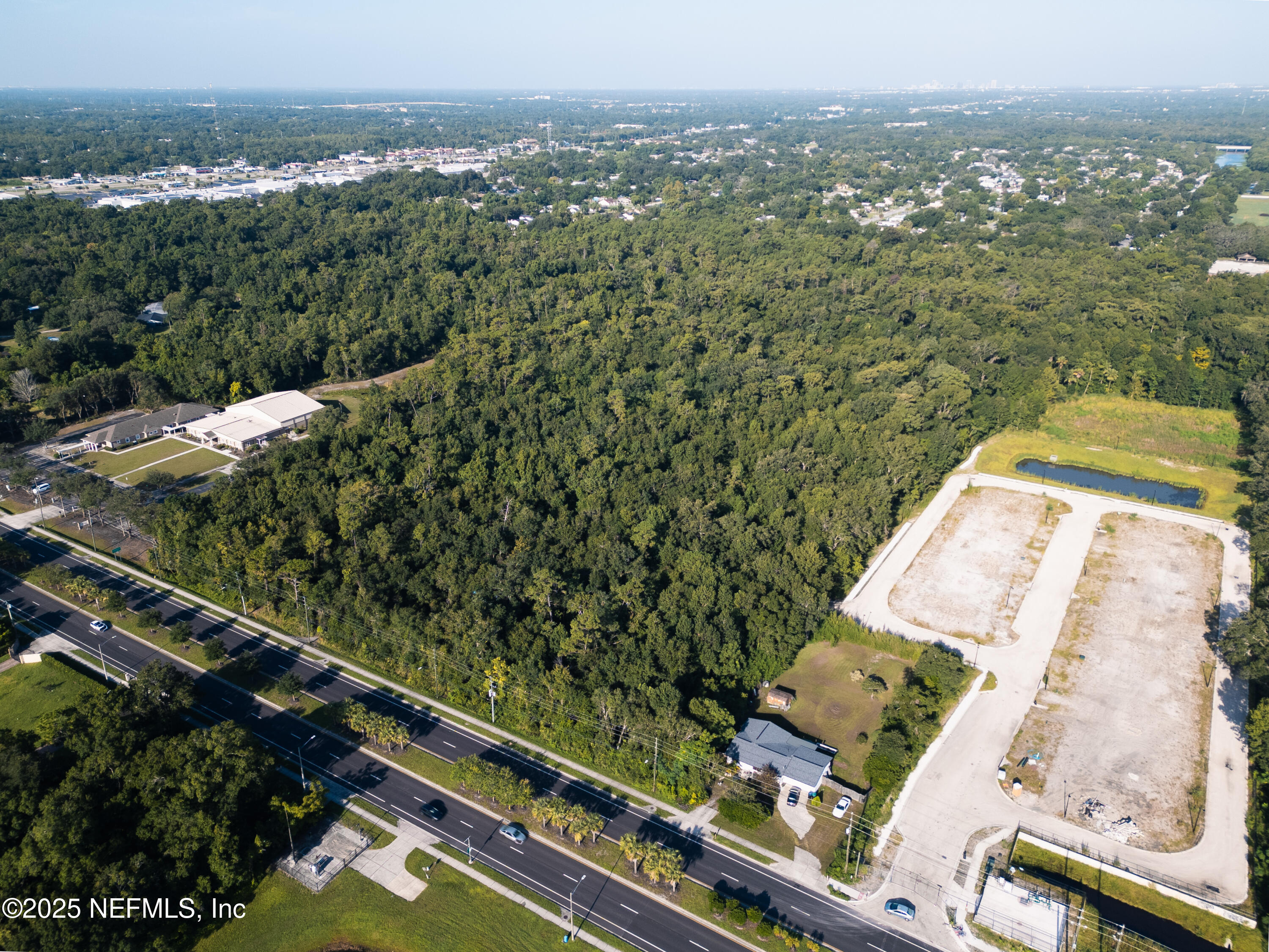 2316 Rouse Road Orlando, FL 32817 - Photo 8 of 13 an aerial view of residential houses with outdoor space