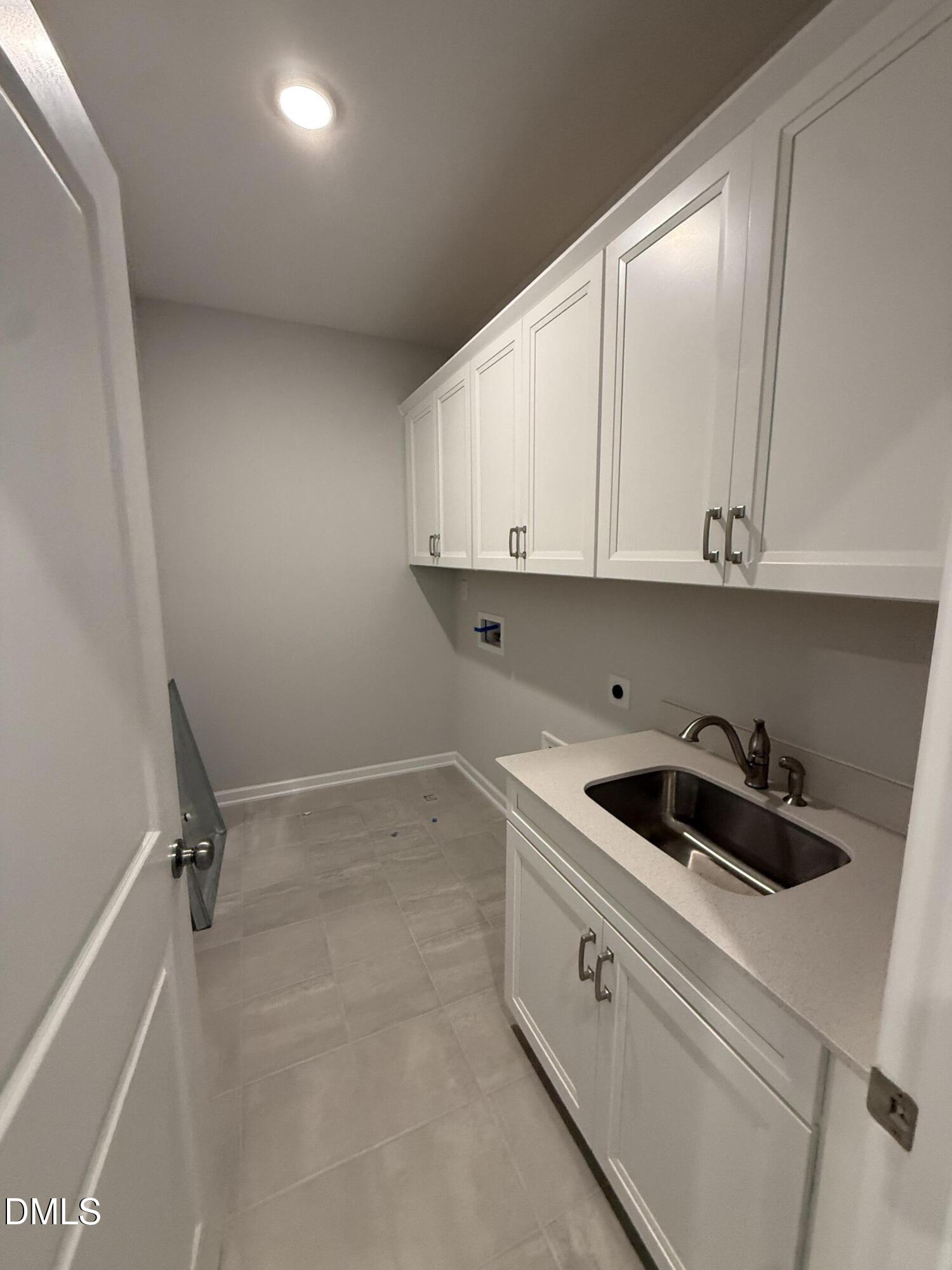 2429 Picual Way Apex, NC 27502 - Photo 8 of 21 a kitchen with a sink and cabinets