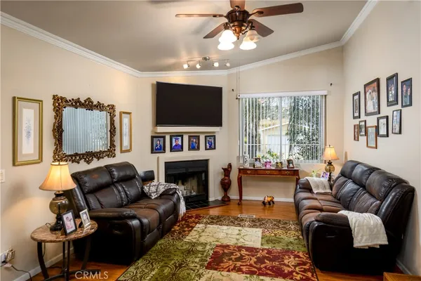 a view of a livingroom with workspace and a window