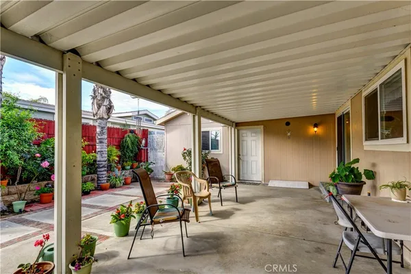 a front view of a house with outdoor seating