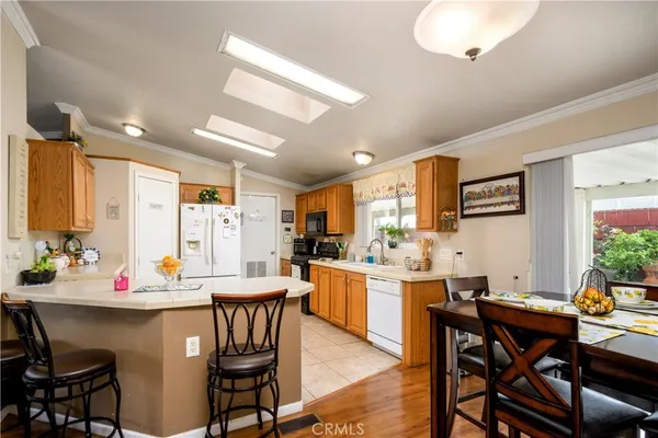 a kitchen with stainless steel appliances a refrigerator and a sink