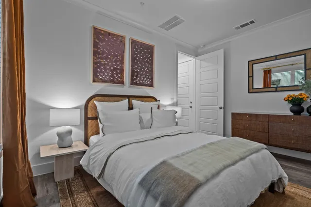 a bedroom with a bed and a cabinets