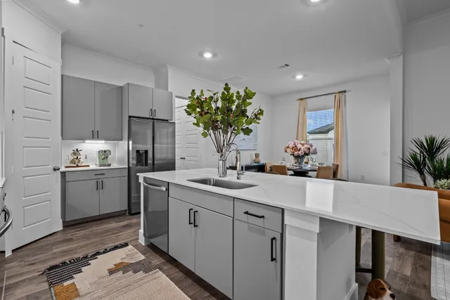 a kitchen with a sink and cabinets