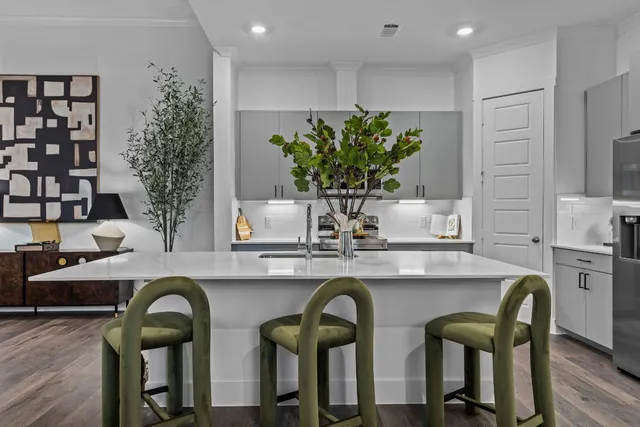 a kitchen with a table and chairs