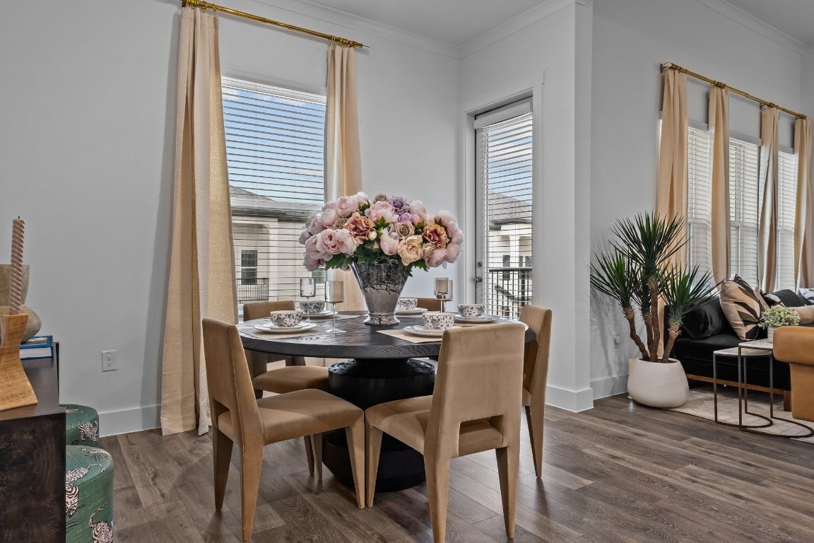 1664 Hillside Terrace, Unit 2117 Buda, TX 78610 - Photo 29 of 33 a dining room with furniture and wooden floor