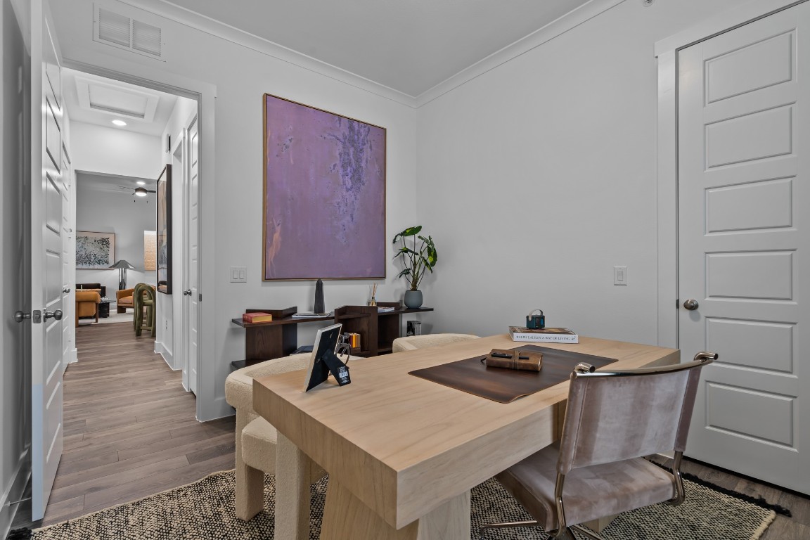 1664 Hillside Terrace, Unit 2117 Buda, TX 78610 - Photo 3 of 33 a kitchen that has a table and chairs in it