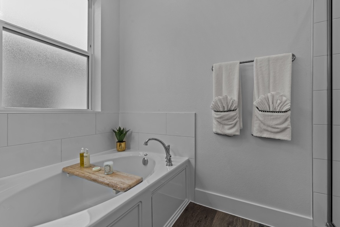 1664 Hillside Terrace, Unit 2117 Buda, TX 78610 - Photo 10 of 33 a bathroom with a sink and a mirror