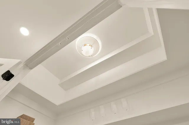 a large white kitchen with a stove a sink a refrigerator and a stove