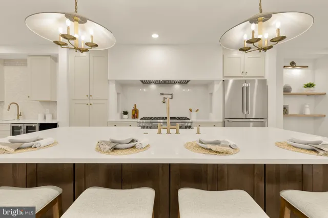 a kitchen with stainless steel appliances granite countertop a sink and cabinets