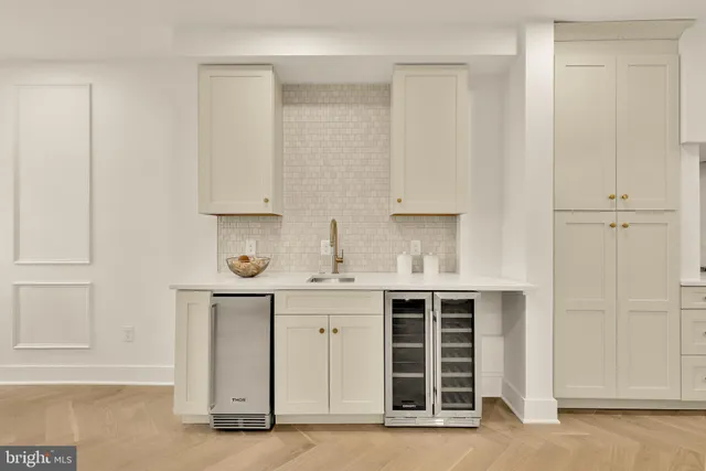 a kitchen with stainless steel appliances a stove sink and refrigerator