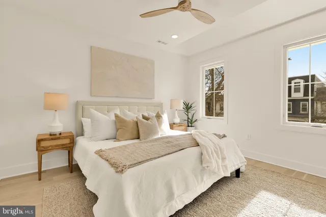 a bathroom with a granite countertop shower sink and mirror