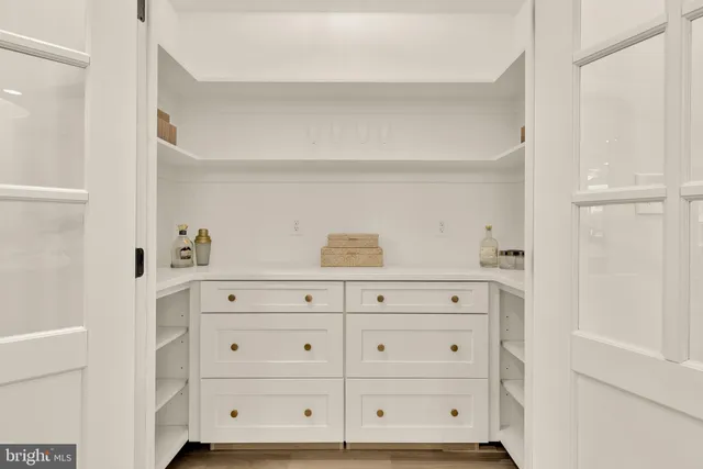 a kitchen with kitchen island cabinets and refrigerator