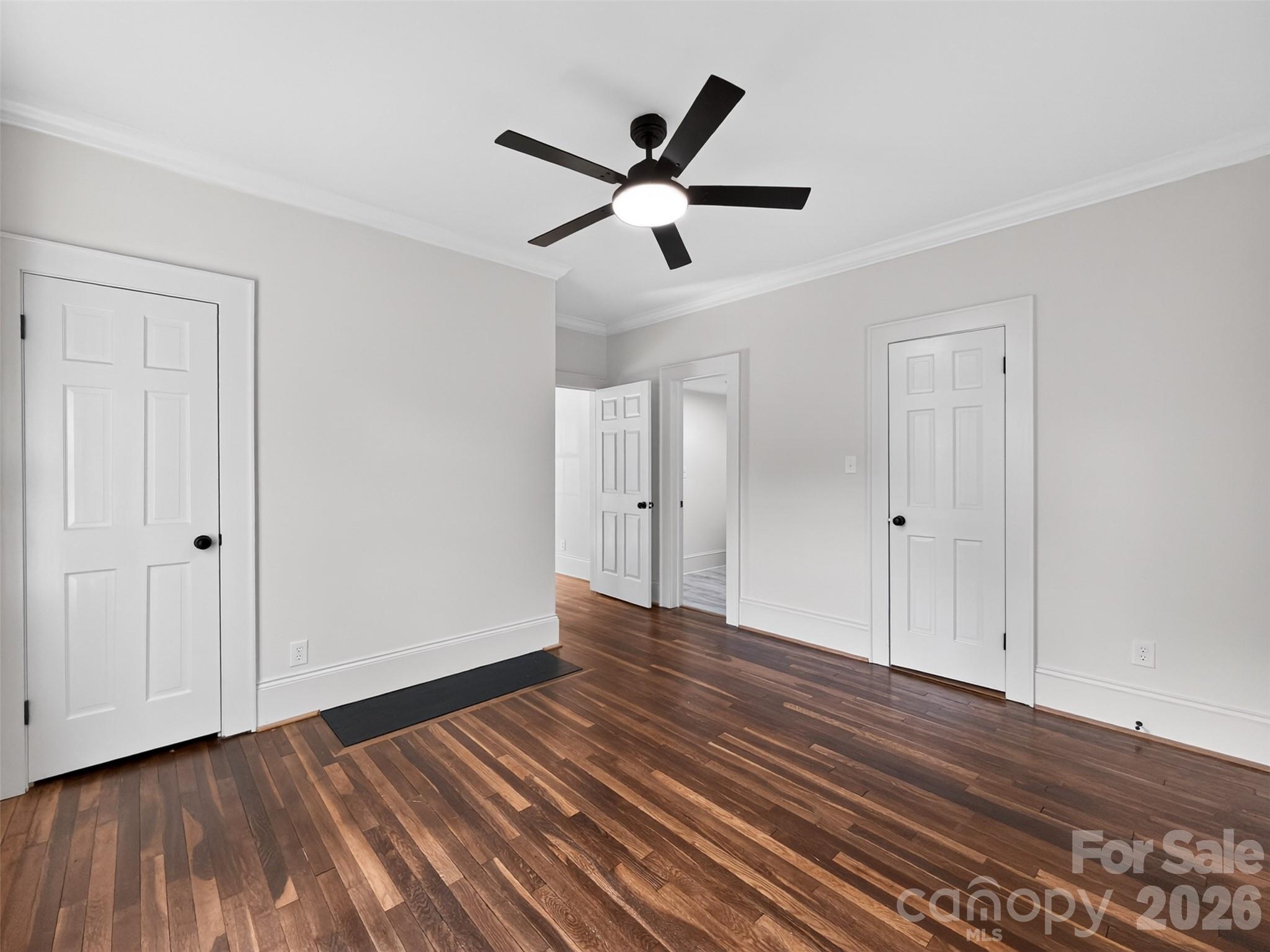 262 Pleasant Street Spindale, NC 28160 - Photo 15 of 37 a view of empty room with wooden floor and ceiling fan