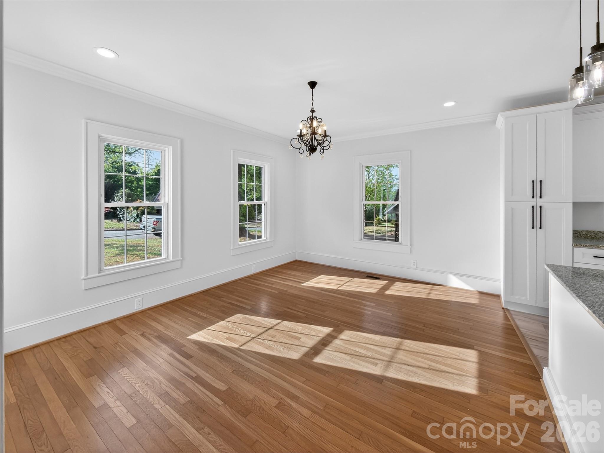 262 Pleasant Street Spindale, NC 28160 - Photo 22 of 37 a view of empty room with wooden floor and fan