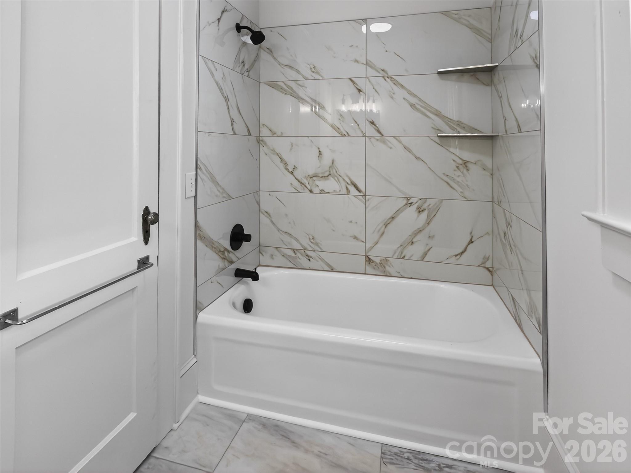 262 Pleasant Street Spindale, NC 28160 - Photo 25 of 37 a bathroom with a bathtub and a shower