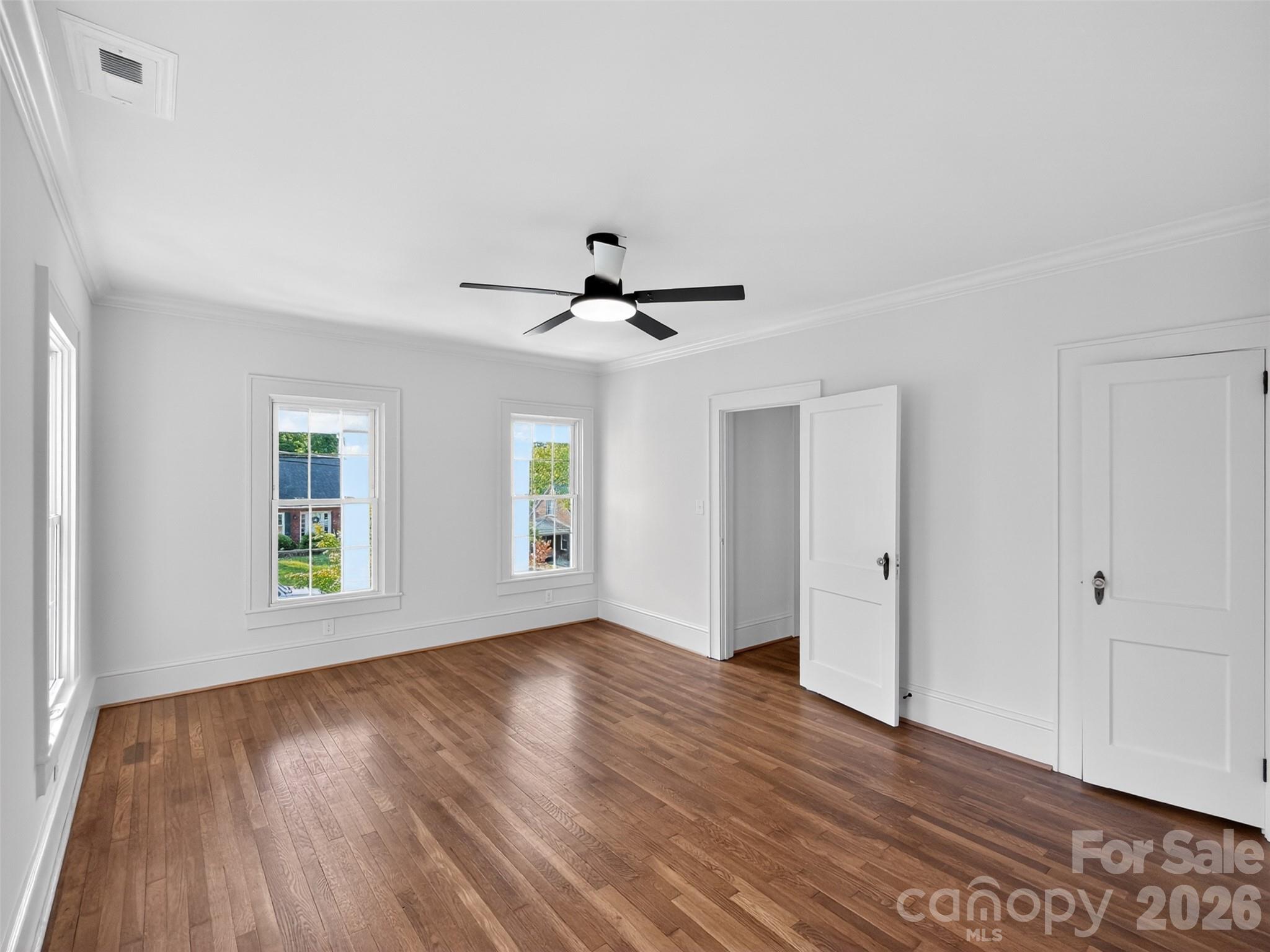 262 Pleasant Street Spindale, NC 28160 - Photo 28 of 37 a view of an empty room with wooden floor and a window