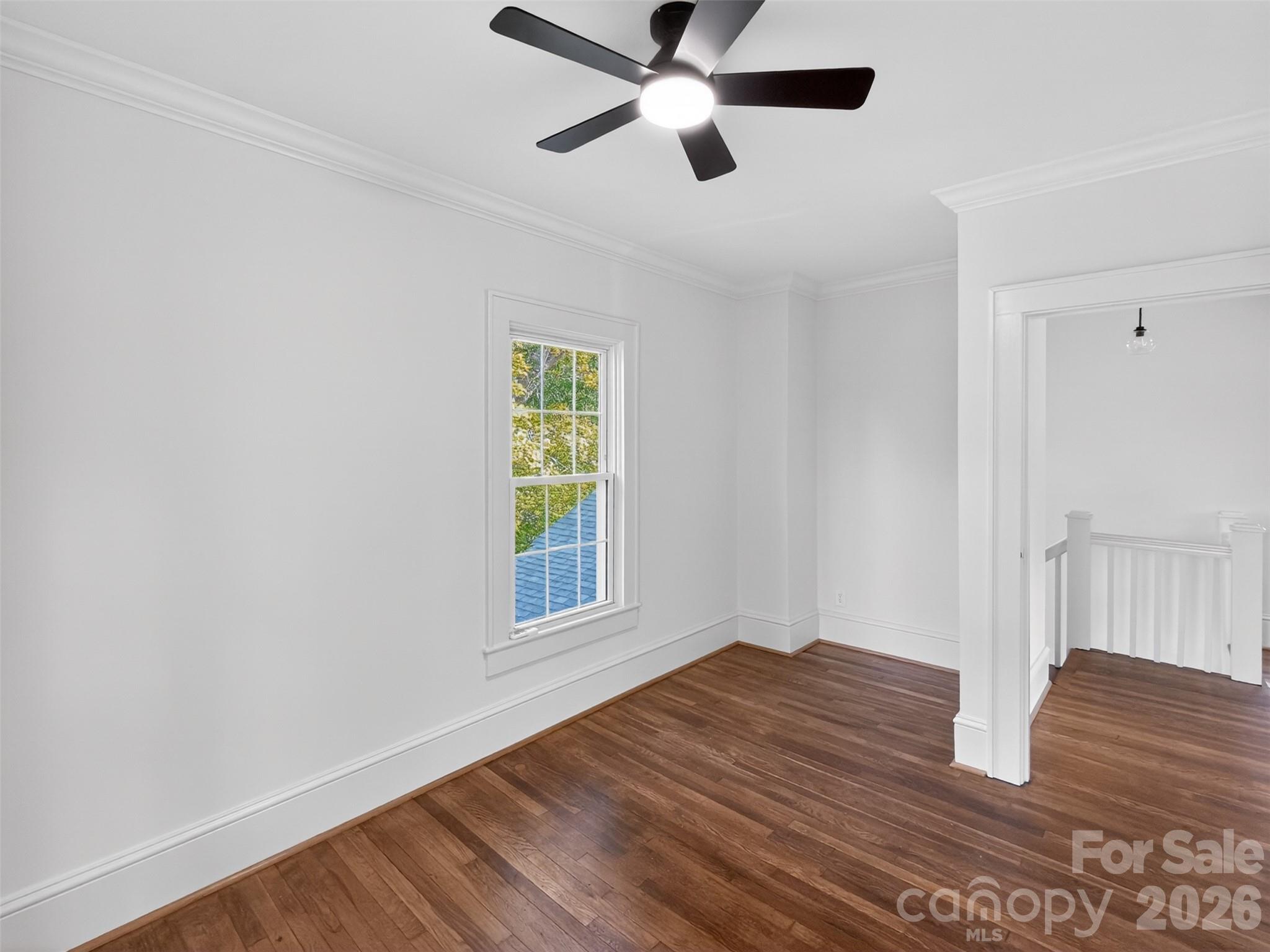 262 Pleasant Street Spindale, NC 28160 - Photo 31 of 37 wooden floor in an empty room with a window