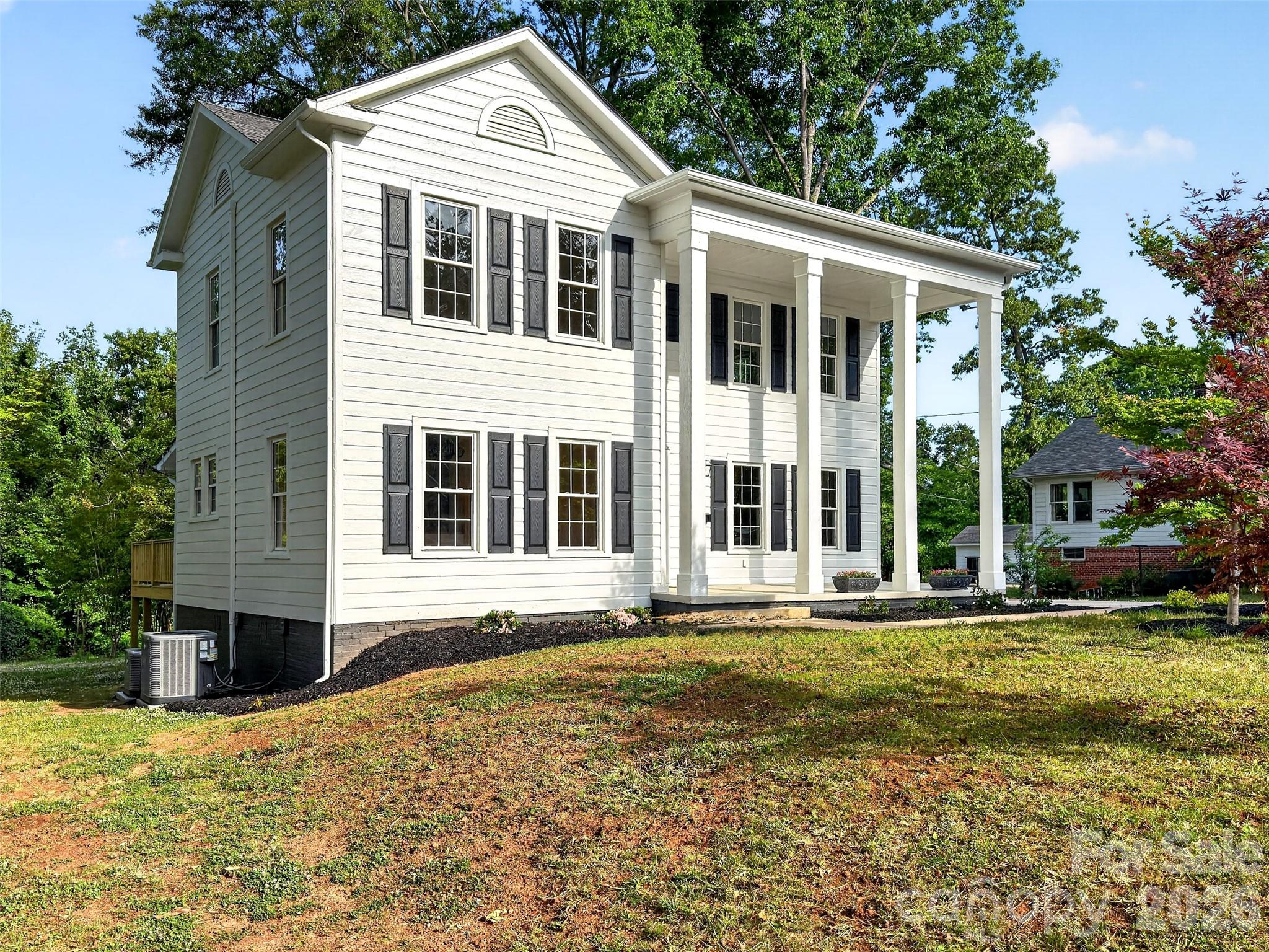 262 Pleasant Street Spindale, NC 28160 - Photo 34 of 37 a front view of a house with a yard