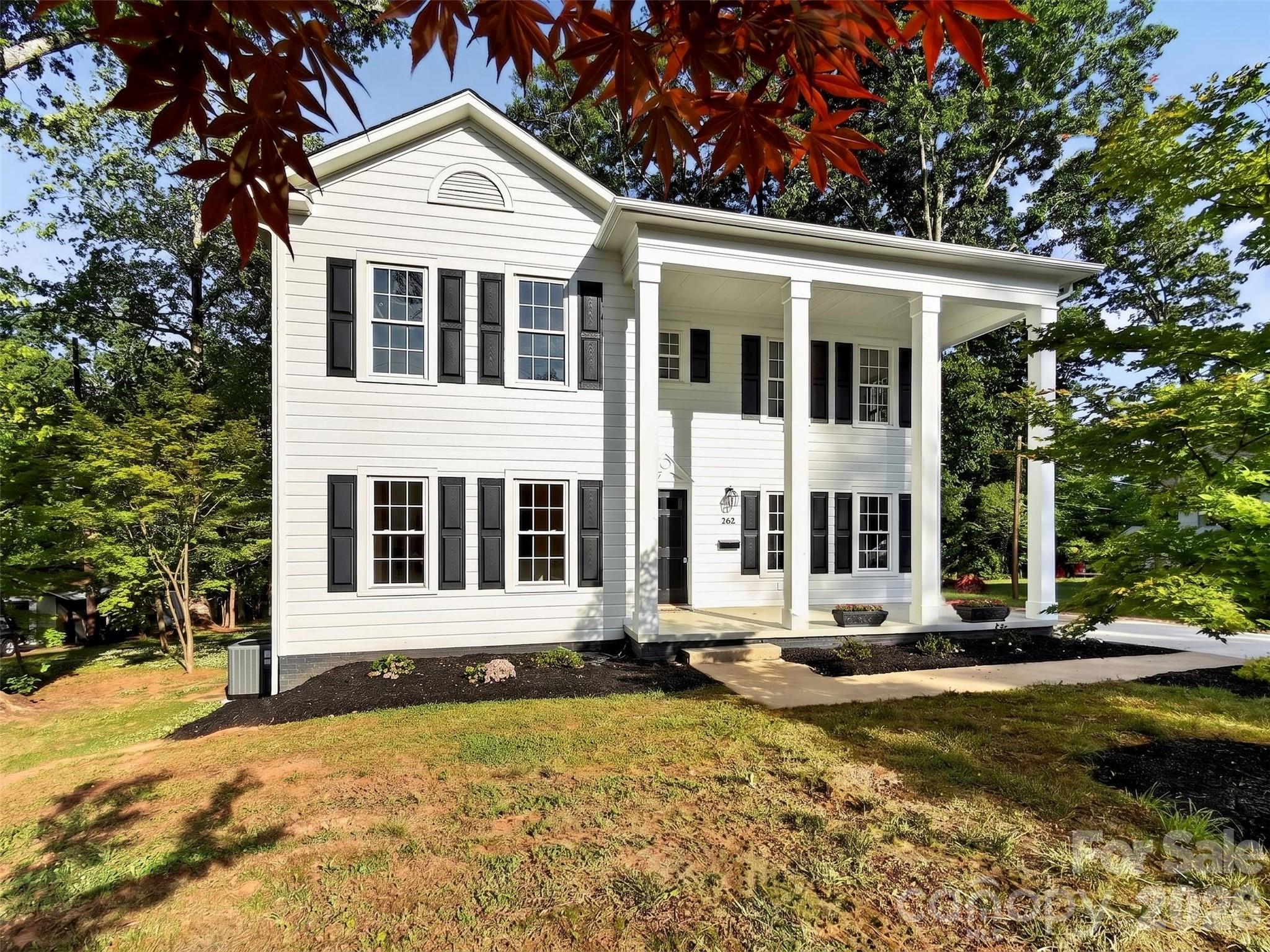262 Pleasant Street Spindale, NC 28160 - Photo 35 of 37 a front view of a house with a yard