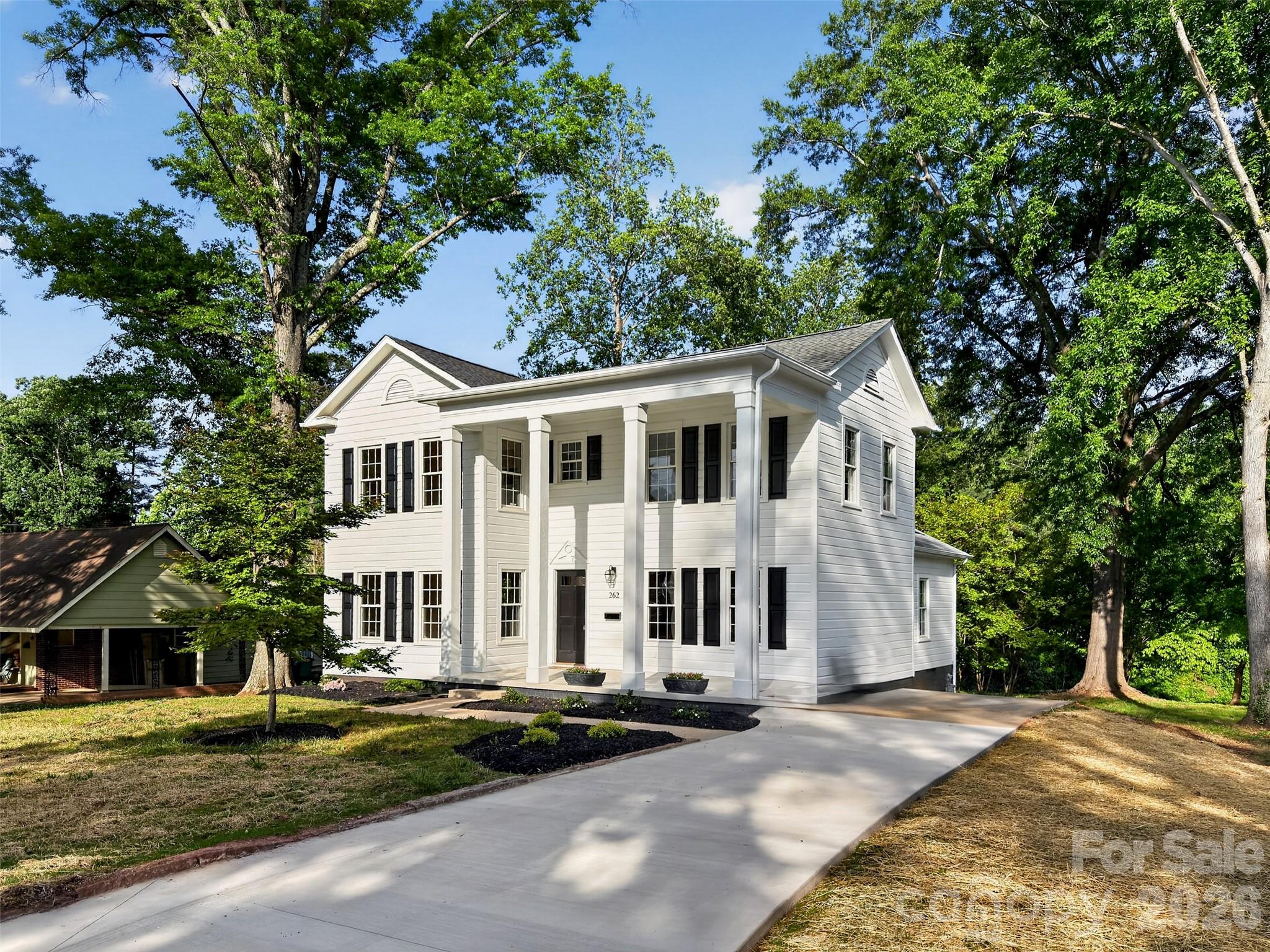 262 Pleasant Street Spindale, NC 28160 - Photo 36 of 37 a view of a white house with a yard