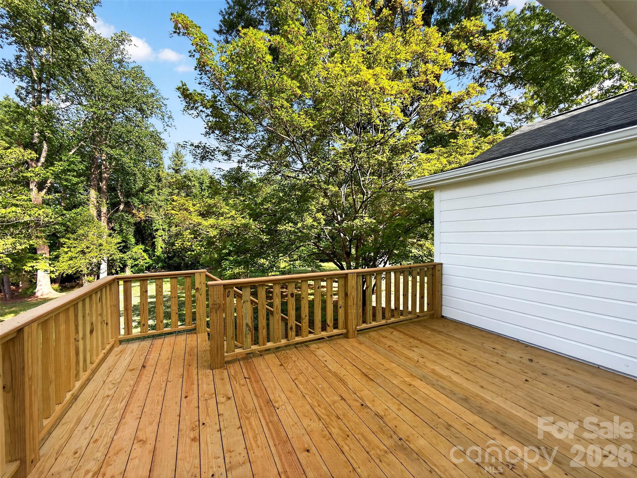262 Pleasant Street Spindale, NC 28160 - Photo 5 of 37 a view of deck with wooden floor and outdoor seating