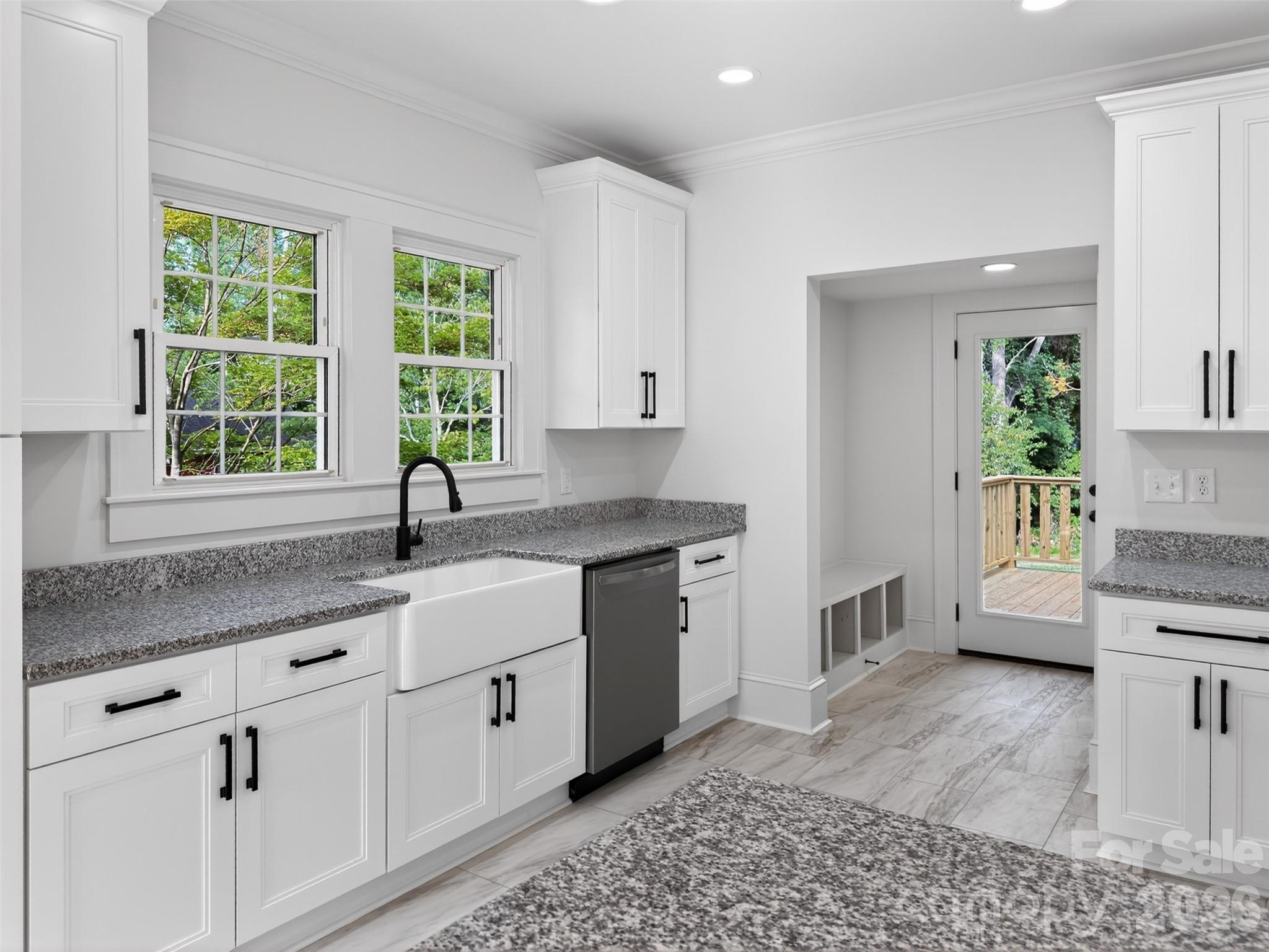 262 Pleasant Street Spindale, NC 28160 - Photo 6 of 37 a kitchen with a sink and a stove top oven