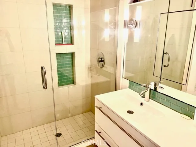 a bathroom with a tub and a shower