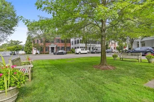 a view of a house with a yard patio and sitting area