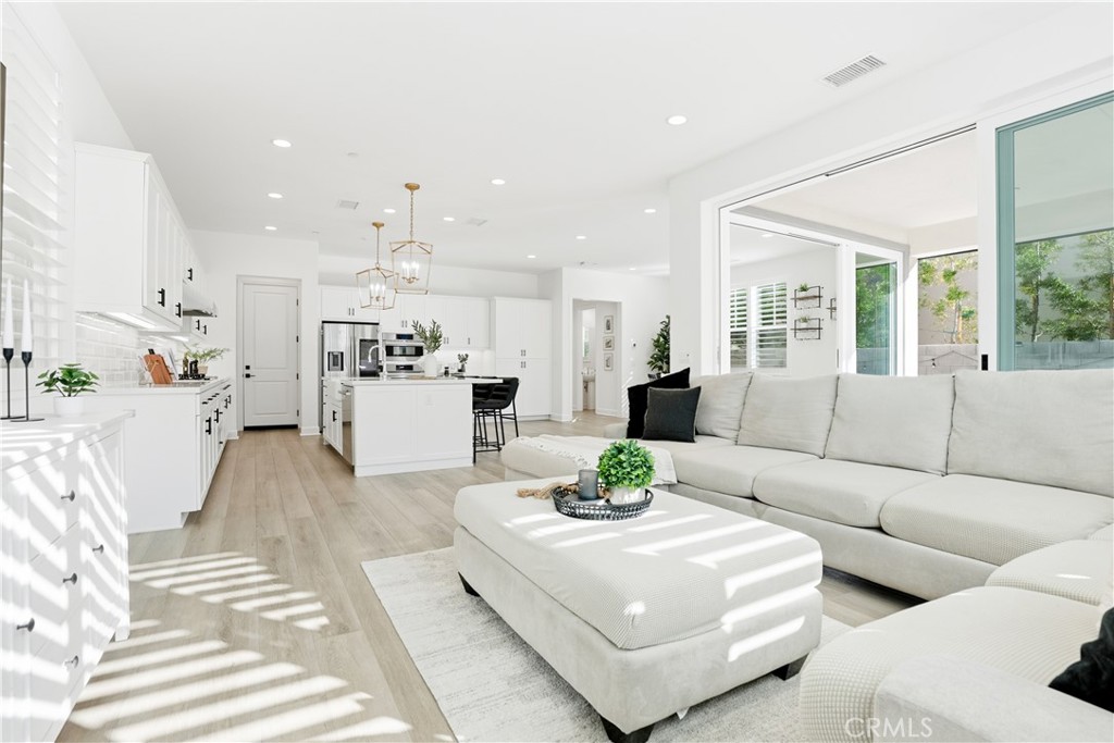 135 Medano Street Rancho Mission Viejo, CA 92694 - Photo 16 of 67 a living room with furniture and a large window