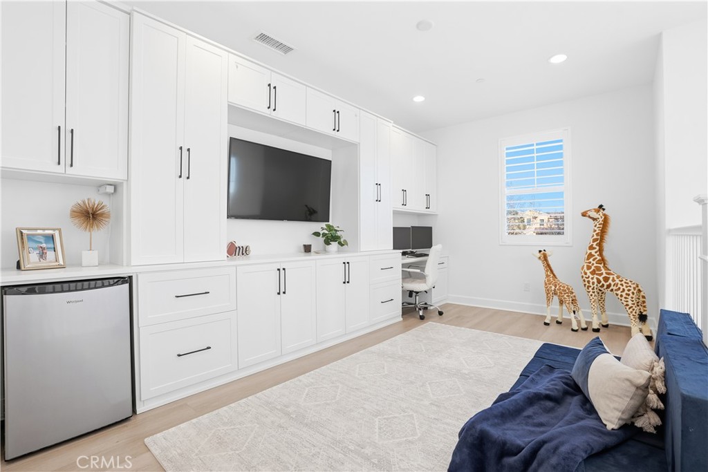 135 Medano Street Rancho Mission Viejo, CA 92694 - Photo 18 of 67 a bedroom with furniture and a flat screen tv