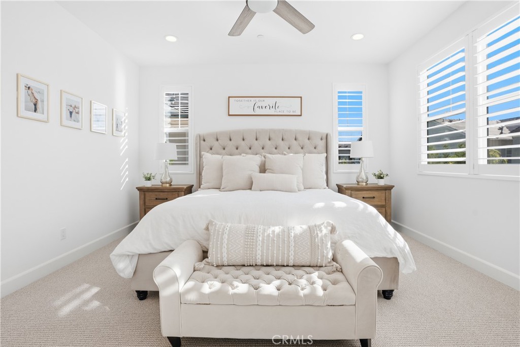135 Medano Street Rancho Mission Viejo, CA 92694 - Photo 22 of 67 a bed sitting in a bedroom next to a window