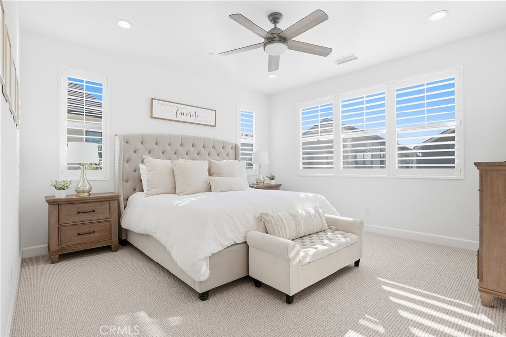 135 Medano Street Rancho Mission Viejo, CA 92694 - Photo 23 of 67 a bedroom with a bed couch and window