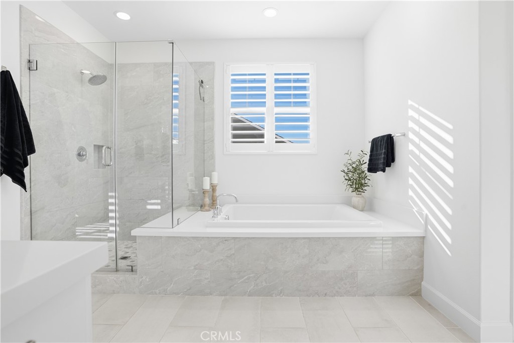 135 Medano Street Rancho Mission Viejo, CA 92694 - Photo 26 of 67 a bathroom with a bathtub and a sink