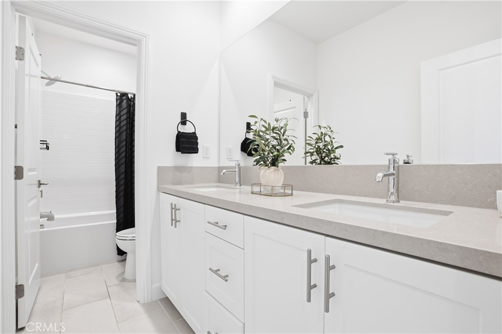 135 Medano Street Rancho Mission Viejo, CA 92694 - Photo 34 of 67 a bathroom with a sink and a mirror